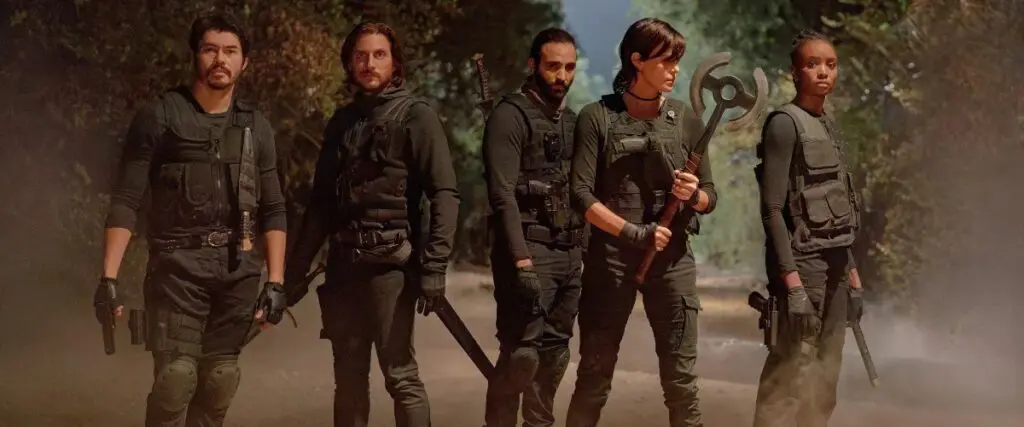 (L-R) Henry Golding as Tuah, Luca Marinelli as Nicky, Marwan Kenzari as Joe, Charlize Theron as Andy and KiKi Layne as Nile in The Old Guard 2.